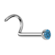 Curved silver nose stud with light blue crystal