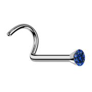 Curved silver nose stud with dark blue crystal