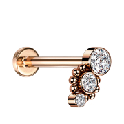 Micro Labret femelle or rose huit boules trois cristaux...