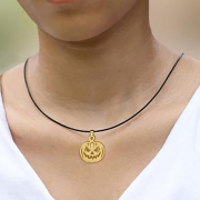 Black chain with gold-plated pumpkin head pendant