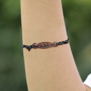 Black wave-patterned bracelet made of narra wood