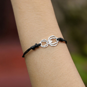 Black bracelet with silver spider pendant