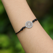 Black bracelet with silver mandala pendant