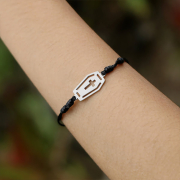 Black bracelet with silver coffin pendant