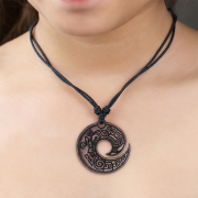 Black necklace with an engraved spiral pendant made of...